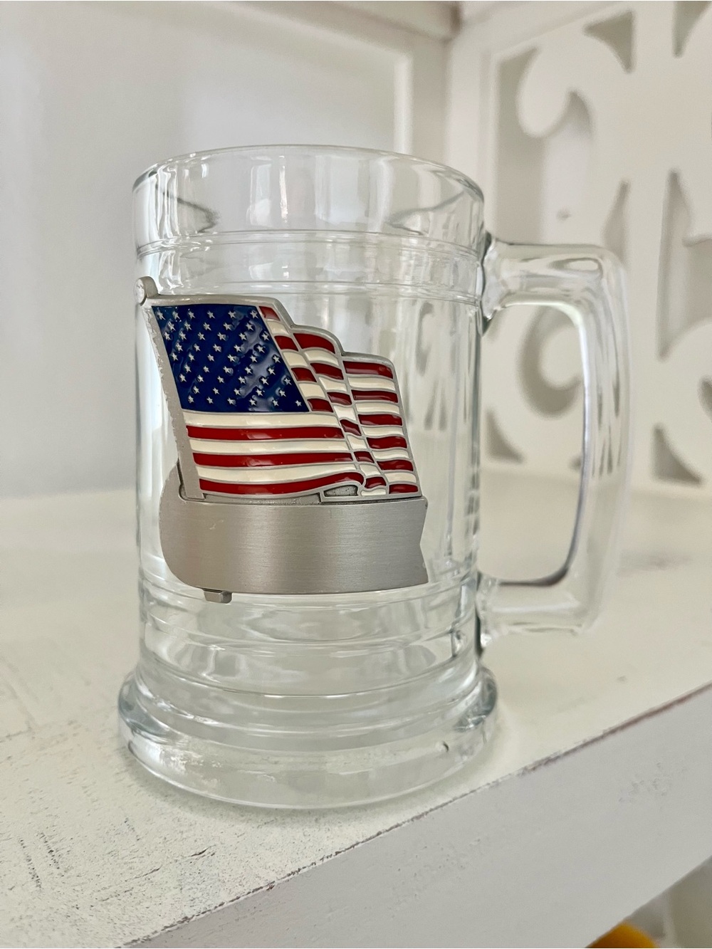 Glass beer stein with an applied pewter American flag emblem